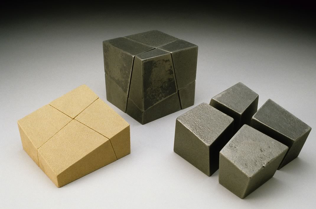 Tom Joyce, cast iron sculpture, Metro Show - NORTH, SOUTH, EAST, WEST - cast ductile iron - 8 pieces forming a 6" cube - Photograph: Kohler Art/Industry Program Tom Joyce, cast iron sculpture, Metro Show - NORTH, SOUTH, EAST, WEST - cast ductile iron - 8 pieces forming a 6" cube - Photograph: Kohler Art/Industry Program